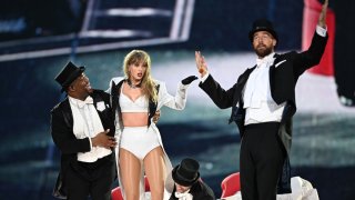 Taylor Swift is joined on stage by Travis Kelce (R), during “Taylor Swift | The Eras Tour” at Wembley Stadium on June 23, 2024 in London, England.