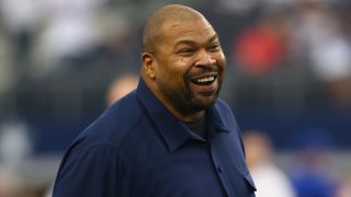 ARLINGTON, TX – OCTOBER 19:  Former NFL player Larry Allen talks with  Mackenzy Bernadeau #73 of the Dallas Cowboys at AT&T Stadium on October 19, 2014 in Arlington, Texas.