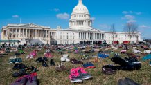 The lawn outside the US Capitol is covered with 7,000 pairs of empty shoes to memorialize the 7,000 children killed by gun violence since the Sandy Hook school shooting, in a display organized by the global advocacy group Avaaz, in Washington, DC, March 13, 2018. / AFP PHOTO / SAUL LOEB        (Photo credit should read SAUL LOEB/AFP via Getty Images)