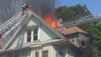 Mayday ordered after firefighter gets trapped on roof of burning building in Boston