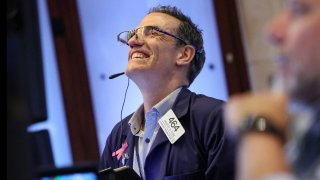 Traders work on the floor of the New York Stock Exchange on June 14, 2024.