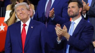 Republican presidential nominee and former U.S. President Donald Trump joins Republican vice presidential nominee J.D. Vance during Day 1 of the Republican National Convention (RNC), at the Fiserv Forum in Milwaukee, Wisconsin, U.S., July 15, 2024. 