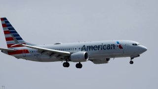 An American Airlines Boeing 737 MAX 8 aircraft approaches San Diego International Airport for a landing from Phoenix on June 28, 2024 in San Diego, California. 