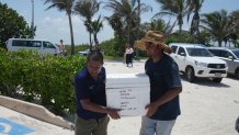 State employees evacuate turtle eggs from the beach to protect them from the incoming Hurricane Beryl, in Cancun, Mexico, Wednesday, July 3, 2024.