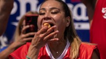 FILE - Competitive eater Miki Sudo eats a hot dog during the 2023 Nathan's Famous Fourth of July hot dog eating contest in the Coney Island section of the Brooklyn borough of New York, July 4, 2023. The annual Nathan’s Famous Fourth of July hot dog eating contest will see a slate of competitive eaters wolf down as many franks as they can in New York City on Thursday, July 4, 2024. 