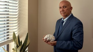 Dr. Fernando Taveras, a psychiatrist and Hispanic mental healthcare expert with SOMOS Community Care Clinic, stands for a portrait in New York on Wednesday, July 3, 2024.