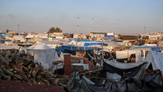 Families take refuge at makeshift tents in southern Gaza Strip