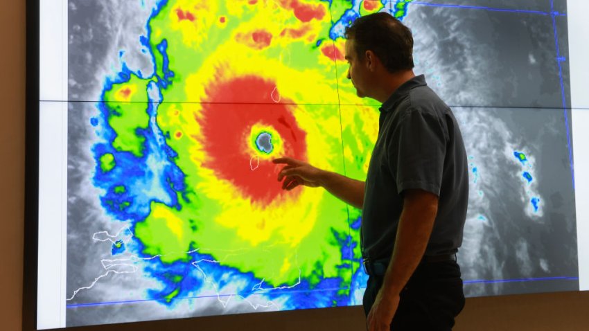 MIAMI, FLORIDA – JULY 01: John Cangialosi, Senior Hurricane Specialist at the National Hurricane Center, inspects a satellite image of Hurricane Beryl, the first hurricane of the 2024 season, at the National Hurricane Center on July 01, 2024 in Miami, Florida. On Monday afternoon, the storm, centered 30 miles west-northwest of Carriacou Island, became the strongest hurricane this early in the season in this area of the Atlantic. (Photo by Joe Raedle/Getty Images)