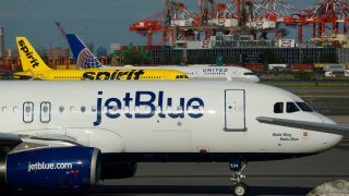 FILE -- JetBlue Airways, Spirit Airlines and United Airlines airplanes proceed to gates after landing at Newark Liberty International Airport in Newark, New Jersey, on May 30, 2024.