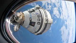 Boeing spacecraft Starliner is seen from the window of SpaceX’s Dragon capsule “Endeavour” on July 3, 2024 while docked with the International Space Station during the crew flight test.