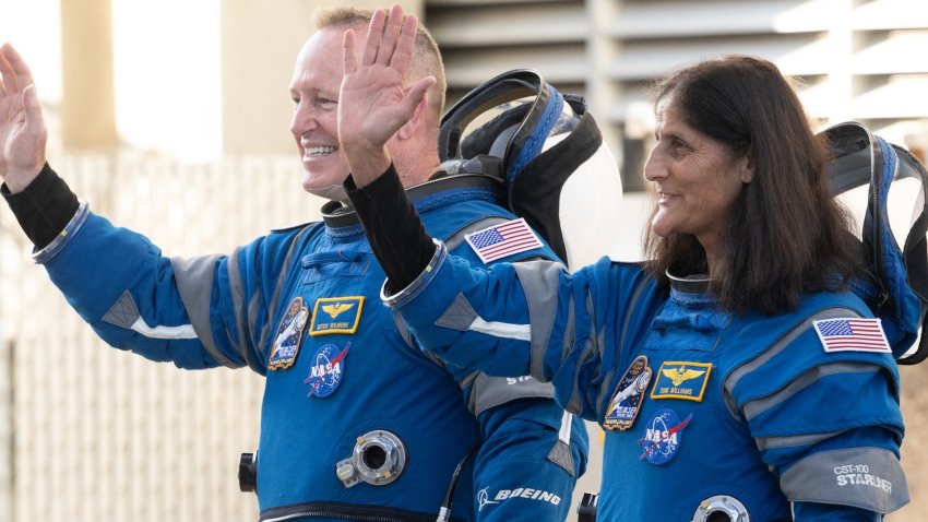 Butch Williams and Suni Williams prepare to board Boeing Starliner