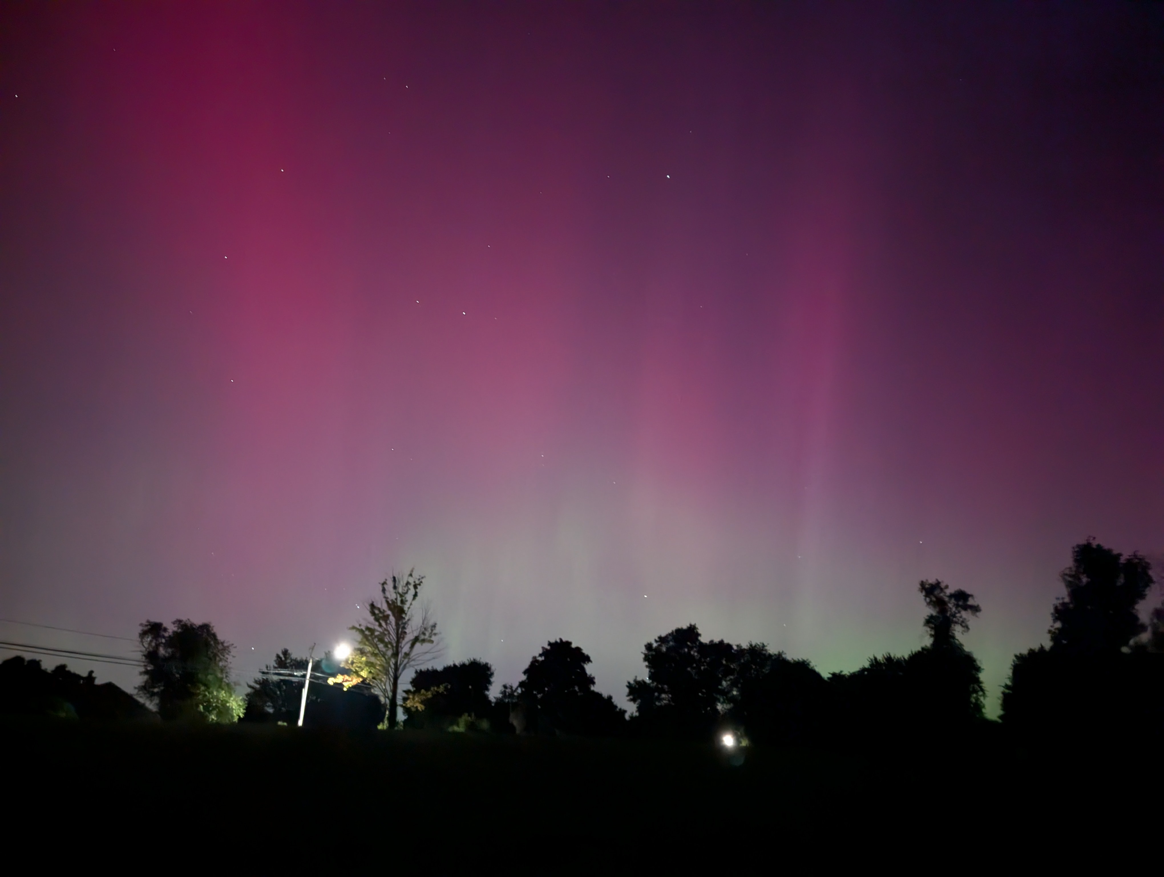 Aurora was visible to the naked eye briefly a little after 2:00 a.m. Vertical stripes and some pink color were seen. The photo picked up green I could not see.