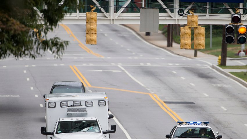 An ambulance arrives at Emory University Hospital on Saturday, Aug. 2, 2014.