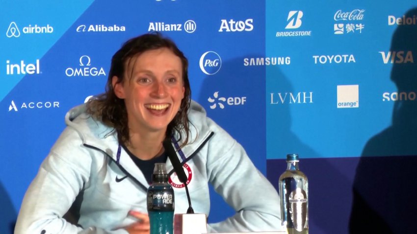 Katie Ledecky smiles during a press conference