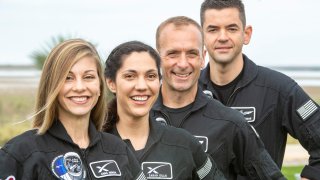 BOCA CHICA, TX – FEBRUARY 11:  The Crew of the next SpaceX private astronaut flight called Polaris Dawn, (Left to Right) Anna Menon, who works to develop astronaut operations for SpaceX, Sarah Gillis, lead space operations engineer, SpaceX, Scott Poteet, who served as the mission director of the Inspiration4 mission SpaceX, and Jared Isaacman, who is financing the mission, Pose at the Starbase Complex in Boca Chica. Photo by Jonathan Newton/The Washington