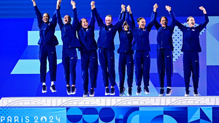 Silver medallists team USA celebrate on the podium of the artistic swimming team event during the Paris 2024 Olympic Games at the Aquatics Centre in Saint-Denis, north of Paris, on August 7, 2024.