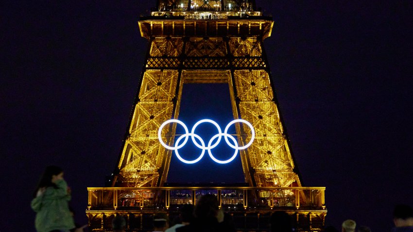 The Olympic rings are displayed on the Eiffel Tower at night between the Paris 2024 Olympic and Paralympic Games, in Paris on August 19, 2024.