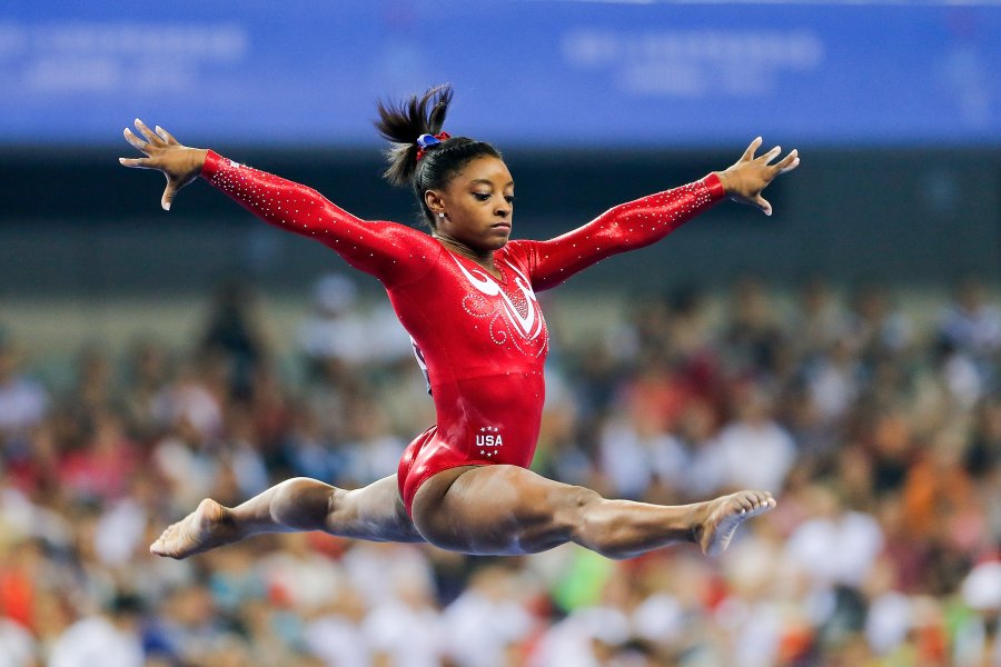 Biles performs on the balance beam