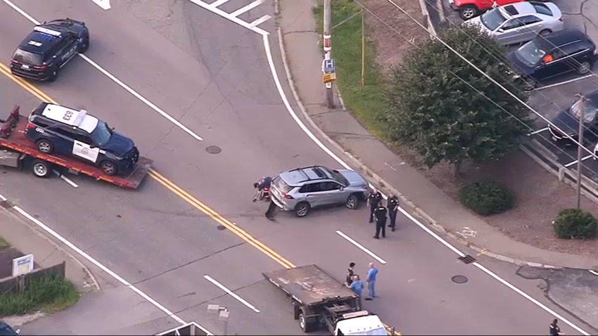 The scene of a crash in Easton, Massachusetts, that police say is tied to a situation that started in Brockton.