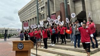 Workers with Unite Here Local 26 gathered on the steps of Boston City Hall on Aug. 8 to announce the results of a strike authorization vote.