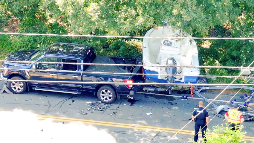 A pickup truck and boat that were involved in a deadly crash in Yarmouth, Massachusetts, on Friday, Aug. 30, 2024.