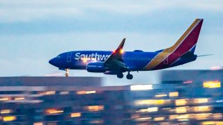 A Southwest Airlines Boeing 737-700 aircraft lands at Ronald Reagan Washington National Airport in Arlington, Virginia, on May 7, 2023.