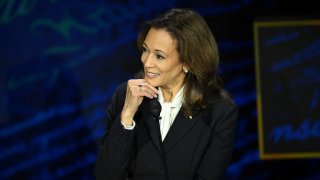 US Vice President and Democratic presidential candidate Kamala Harris listens to former US President and Republican presidential candidate Donald Trump speak during a presidential debate at the National Constitution Center in Philadelphia, Pennsylvania, on September 10, 2024. 