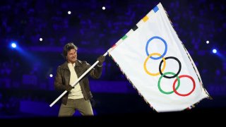 Tom Cruise holds the Olympic flag during the Closing Ceremony of the Paris 2024 Games.