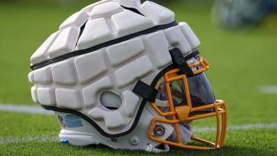 What is the Guardian Cap on football helmets?