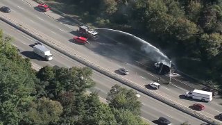 A truck fire being put out on I-95 in Reading, Massachusetts, on Tuesday, Sept. 10, 2024.