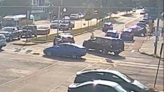 A still image from video showing a group of people lifting a car during an emergency response on Broadway Thursday, Sept. 12, 2024.