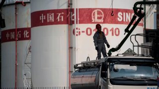 A man working in a filling station of Sinopec, China Petroleum and Chemical Corporation, in Shanghai, China, on March 22, 2018.