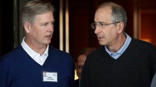 (L-R) Michael Cavanagh, then-chief financial officer of Comcast, talks with Brian Roberts, chief executive officer of Comcast, as they arrive for the annual Allen & Company Sun Valley Conference, July 9, 2019 in Sun Valley, Idaho.