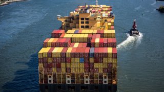 A container ship departs the Port of Newark for the Atlantic Ocean on September 30, 2024 seen from New York City. 