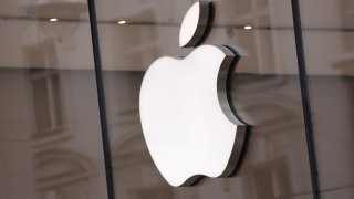 The Apple logo hangs on an Apple Store on March 25, 2024 in Berlin, Germany.