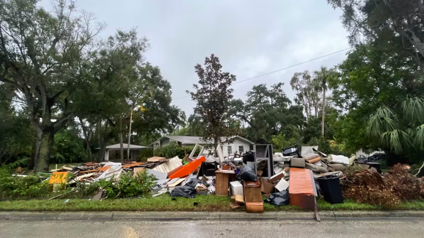 Garbage haulers suspended efforts to remove debris that could be dangerous in high winds.