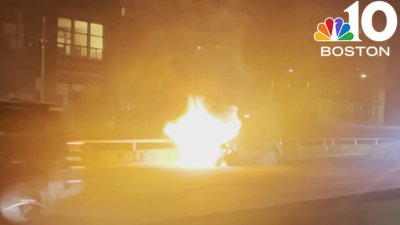 Van catches fire on Mass. Pike