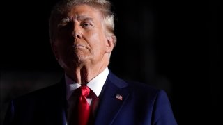 FILE -- Republican presidential nominee former President Donald Trump listens to opera singer Christopher Macchio after speaking at a campaign rally at the Butler Farm Show, Saturday, Oct. 5, 2024, in Butler, Pa.