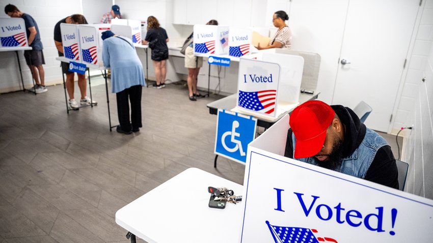 People vote on the first day of Virginia's in-person early voting at Long Bridge Park Aquatics and Fitness Center on Sept. 20, 2024, in Arlington, Virginia.