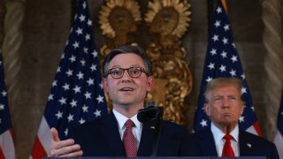 File - Former President Donald Trump listens as Speaker of the House Mike Johnson (R-LA) speaks during a press conference at Mr. Trump’s Mar-a-Lago estate on April 12, 2024, in Palm Beach, Florida.