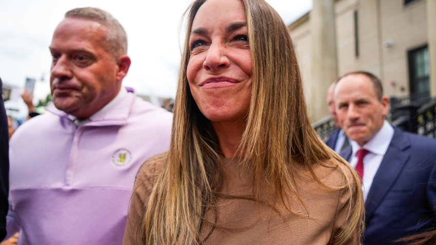 Dedham, MA – July 22: Karen Read walks through a crowd of her supporters after her hearing at Norfolk Superior Court. (Photo by Kayla Bartkowski/The Boston Globe via Getty Images)