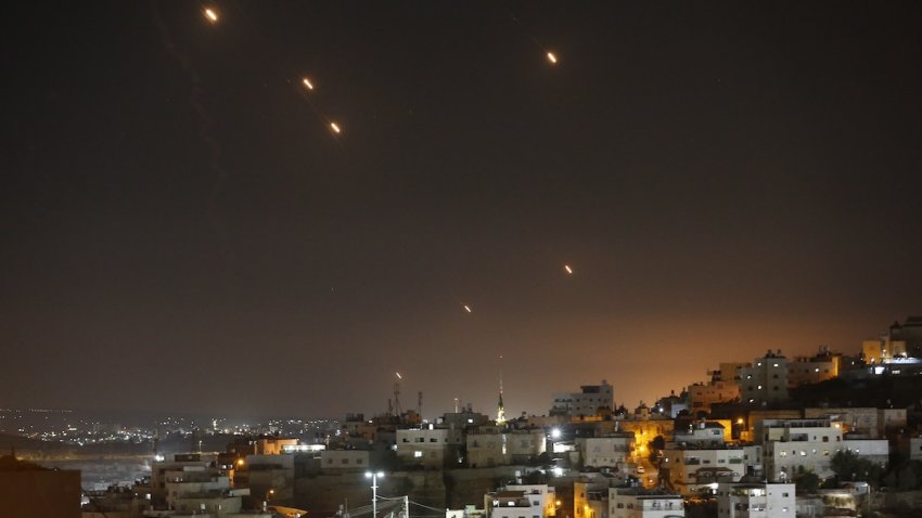 Many rockets, fired from Iran, are seen over Jerusalem from Hebron, West Bank on October 01, 2024.