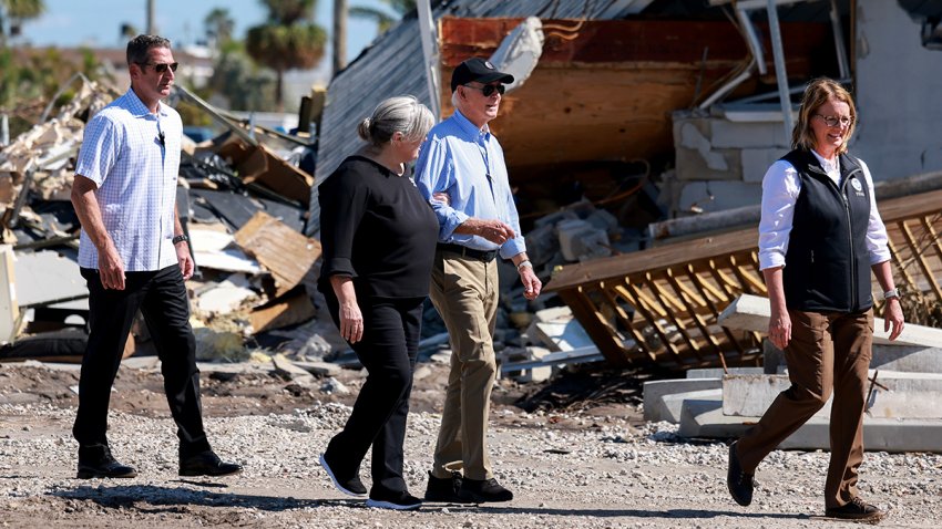 ST PETE BEACH, FLORIDA – OCTOBER 13: U.S. President Joe Biden walks with Pinellas County Emergency Director Cathie Perkins and Deanne Criswell (R), Administrator of the U.S. Federal Emergency Management Agency, after a tour of the damage caused by Hurricane Milton on October 13, 2024 in St Pete Beach, Florida. Biden visited the area as it deals with back-to-back hurricanes that have caused extensive damage. (Photo by Joe Raedle/Getty Images)