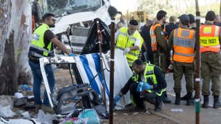 TEL AVIV, ISRAEL - OCTOBER 27: Authorities inspect debris from a truck after a truck hit people waiting at a bus stop near the Glilot junction on October 27, 2024 north of Tel Aviv, Israel. Dozens were reported injured in the initial aftermath of the suspected ramming attack.