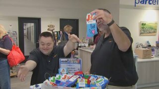 John and Mark Cronin show off the offerings from their company, John’s Crazy Socks