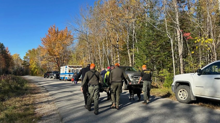 Pamela Helmstadter being taken to an ambulance in Alexander, Maine, on Oct. 17.