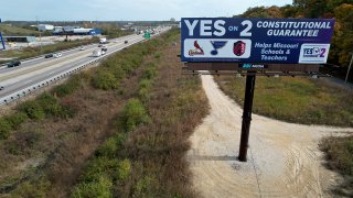 A billboard promoting a ballot measure to legalize sports betting in Missouri is seen along Interstate 44 Wednesday, Oct. 23, 2024, in St. Louis County, Mo.