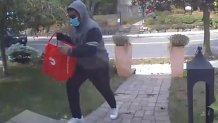 Reading police say the person pictured above stole a package containing a new iPhone from a home on Woburn Street Tuesday.