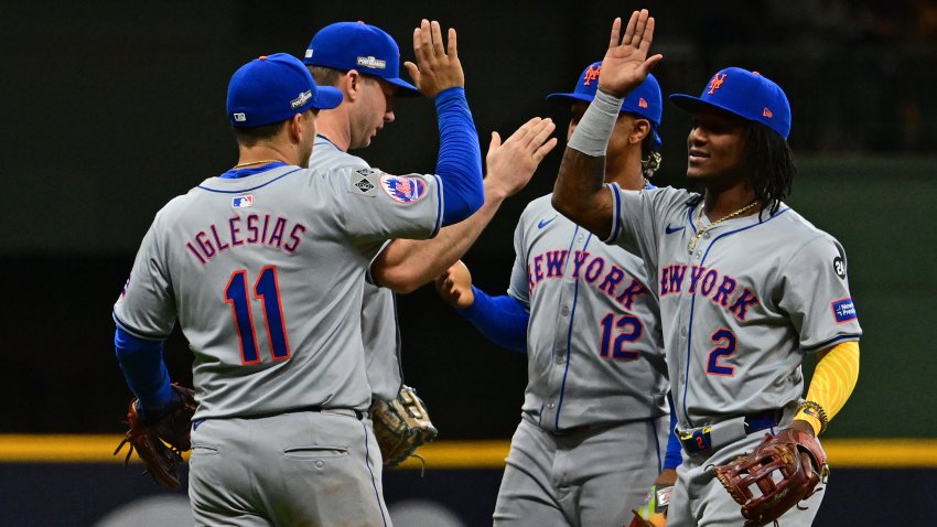 Oct 1, 2024; Milwaukee, Wisconsin, USA; New York Mets second base Jose Iglesias (11) and shortstop Luisangel Acuna (2) react after the ninth inning against the Milwaukee Brewers in game one of the Wildcard round for the 2024 MLB Playoffs at American Family Field. Mandatory Credit: Benny Sieu-Imagn Images