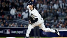 Oct 15, 2024; Bronx, New York, USA; New York Yankees pitcher Gerrit Cole (45) pitches during the first inning against the Cleveland Guardians in game two of the ALCS for the 2024 MLB Playoffs at Yankee Stadium. Mandatory Credit: Wendell Cruz-Imagn Images